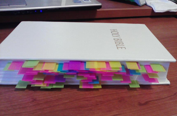 Book with coloured tabs representing the bad parts of the bible